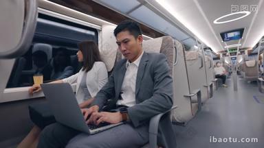 商务人士在高铁上使用笔记本电脑